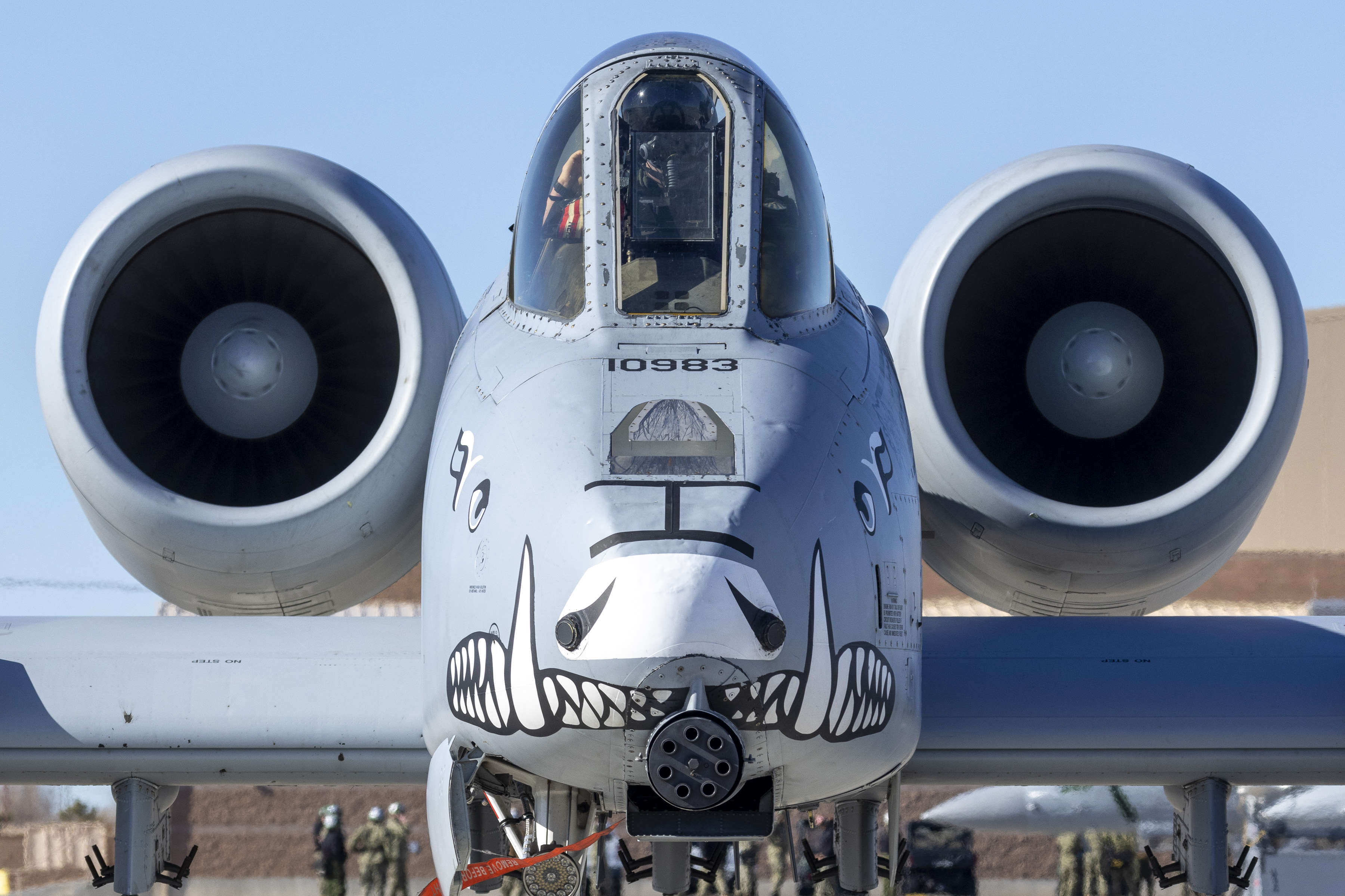 Image shows the nose paint of a United States aircraft on the airbase. 